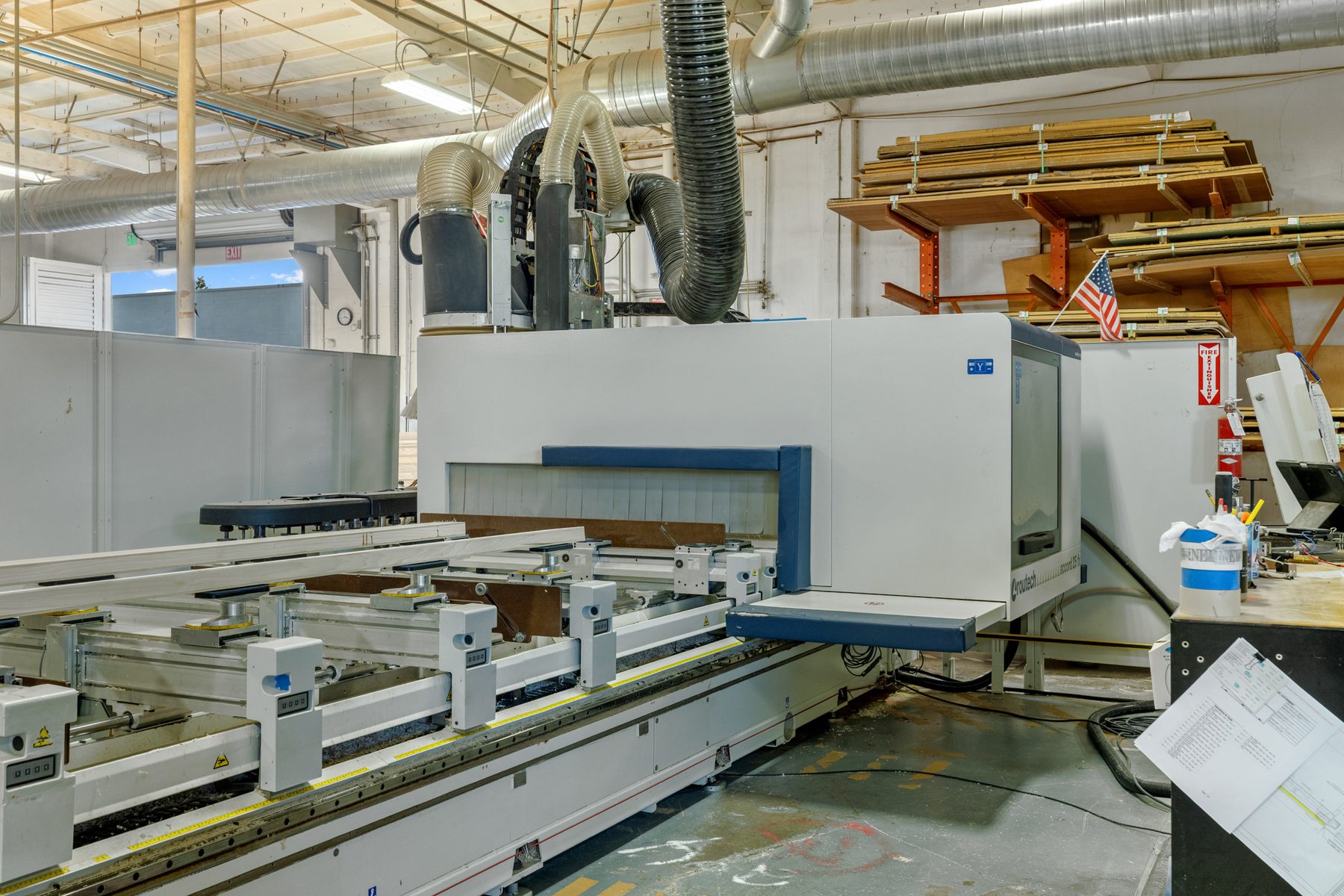 A long CNC beam saw on Fine Line’s shop floor.