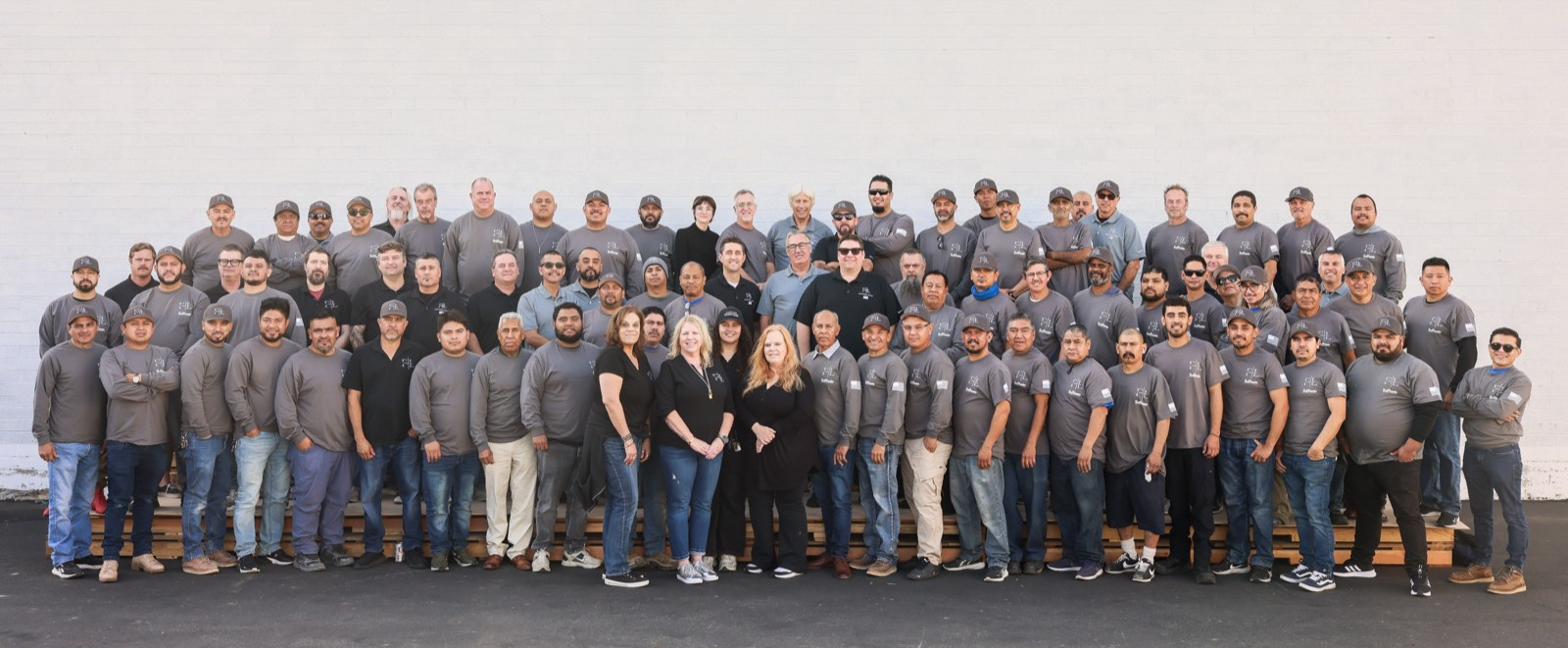The Fine Line Architectural Millwork crew, more than a hundred people, outside the Costa Mesa facility.